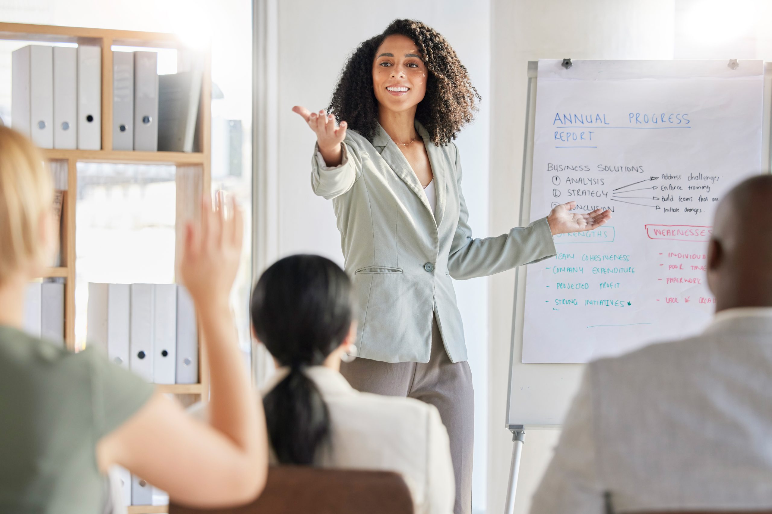 Presentation, question and business black woman in a workshop, conference or meeting for company strategy talking data. Leader, audience and corporate professional female teaching at a seminar.